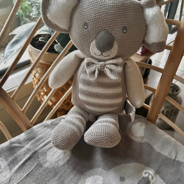 knitted koala baby toy with koala baby blanket in bassinett