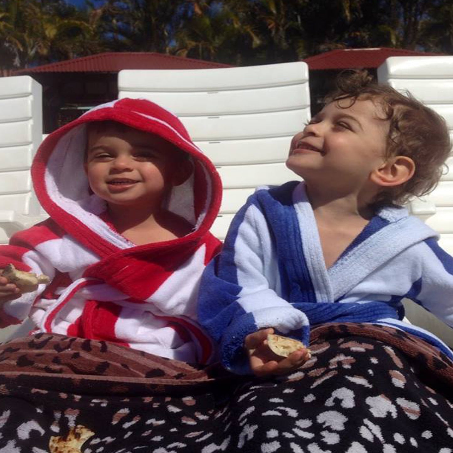 kids wearing stripey kids beach robes