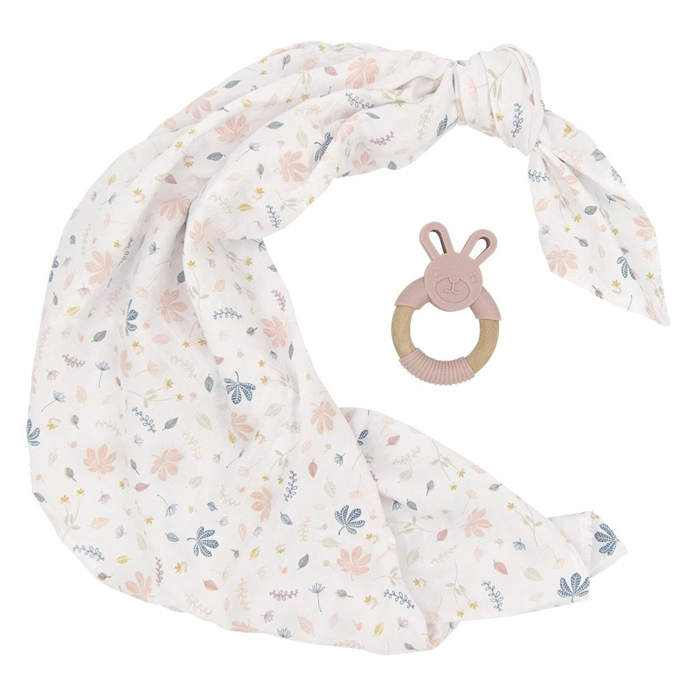 organic muslin pink botanical leaf design baby swaddle with silicone and wooden bunny teether.