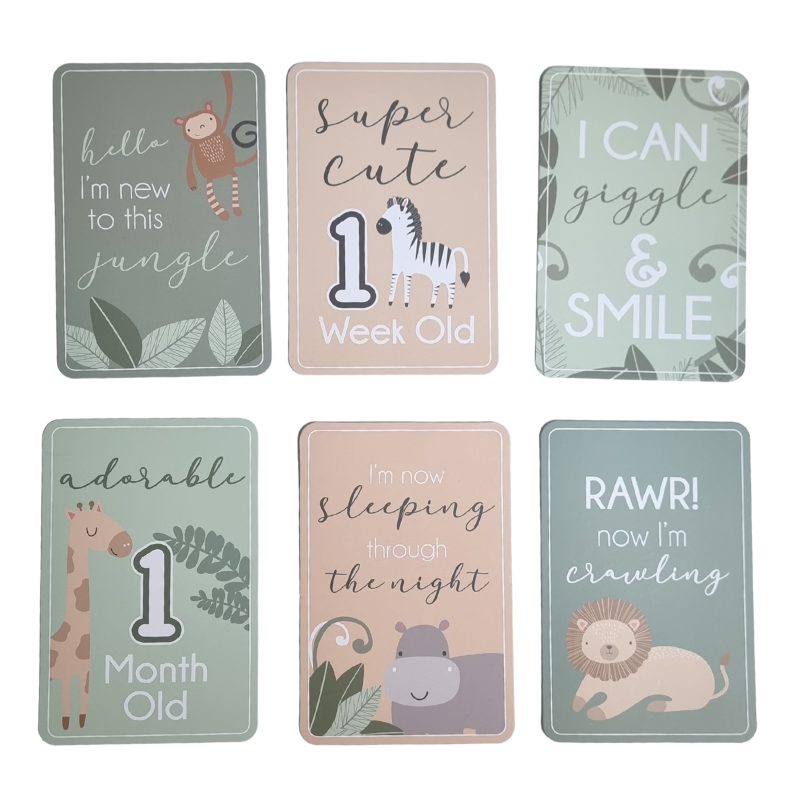 Set of six baby milestone cards with animal illustrations and text.