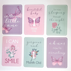 Set of milestone cards with butterfly designs and text on a white background
