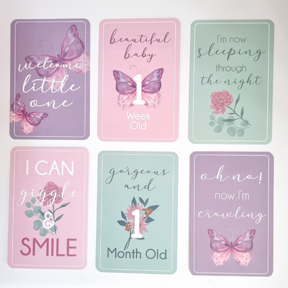 Set of milestone cards with butterfly designs and text on a white background