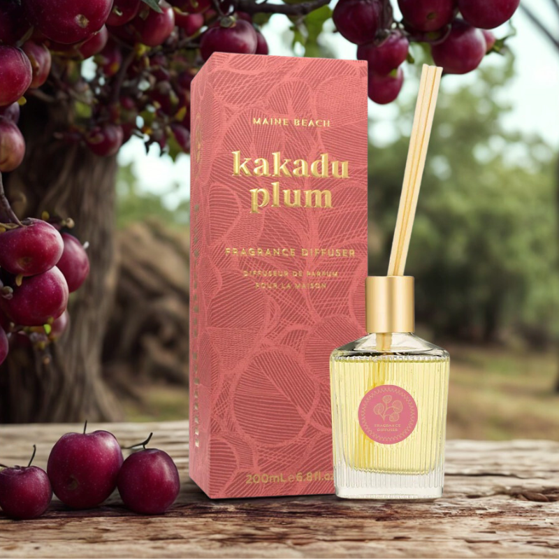 Kakadu plum fragrance diffuser with packaging in front of a plum tree