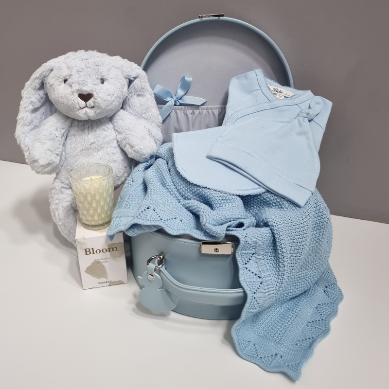 a personalised bunny and blanket presented in a keepsake gift box with clothing and a candle