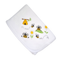 A white baby swaddle wrap with a bumble bee design, featuring illustrations of bees, a beehive, and flowers.