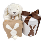 A baby gift hamper set including a neutral toned knitted bunny romper, a plush bunny toy, and a gift hat box with a bunny silhouette design.