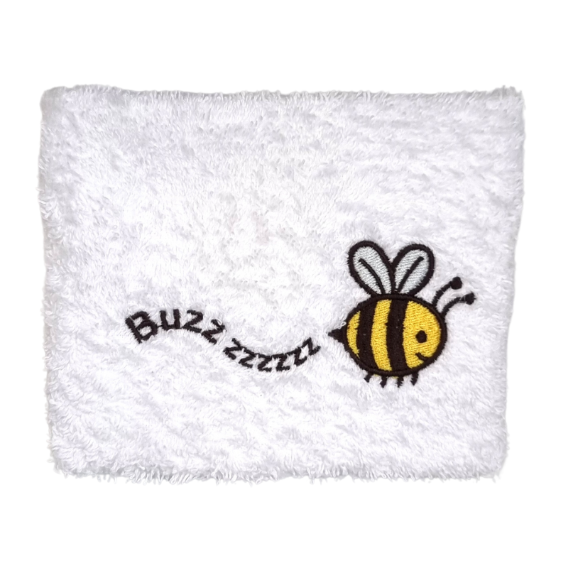 A white baby wash cloth with a embroidered bumble bee design in the corner, with the word 'Buzzzz' written next to it.