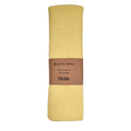 A yellow cotton muslin baby wrap with a label that reads 'Muslin Wrap 100% Cotton 120x120cm 4 kids'.