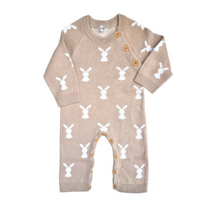 dark beige knitted bunny romper with white bunny pattern and button opening  neck and legs.