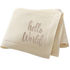 Beige baby blanket with 'hello world' embroidered text on a white background