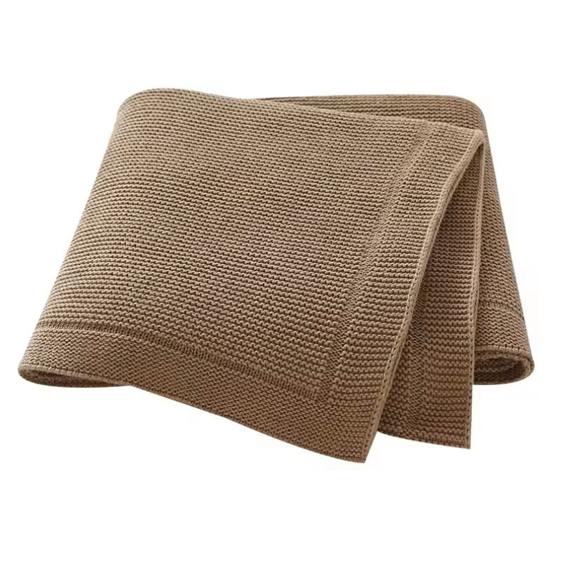A folded brown knitted baby blanket with a solid line bordered edge, displayed on a white background