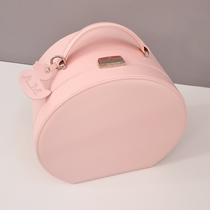 Pink baby keepsake box with a personalised ducky key tag on a light gray background