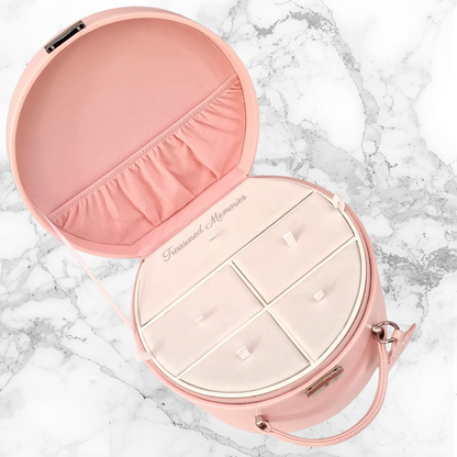 Pink keepsake case and memories tray compartment with a handle on a marble surface