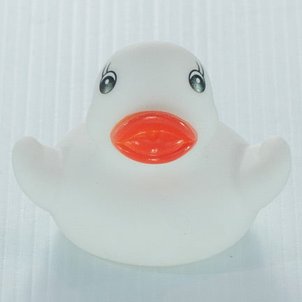 white baby bath ducky. baby bath squirter toy