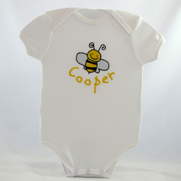 personalised neutral baby body suit embroidered with a cute bumble bee design and the new baby's name