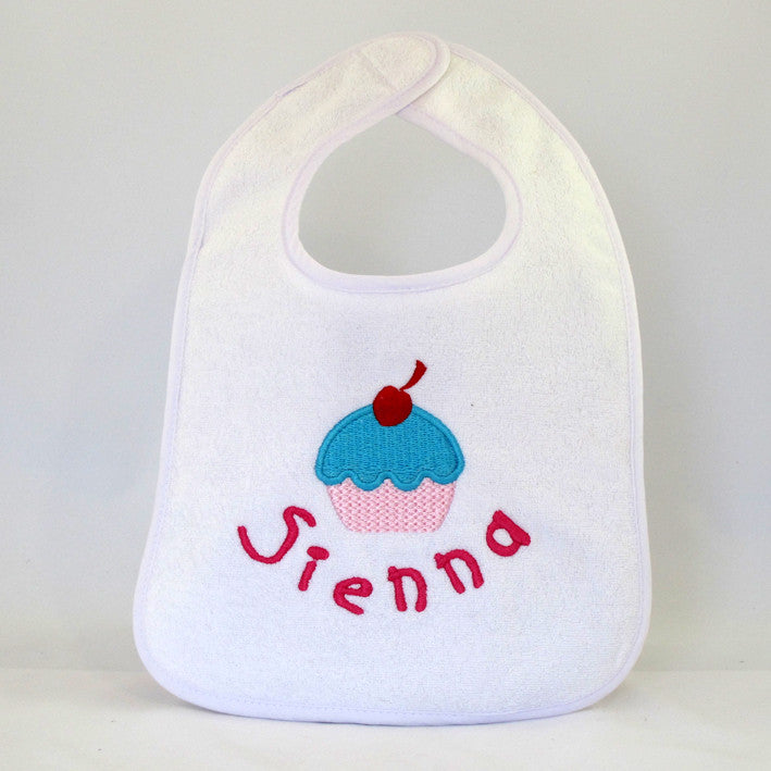 personalised girls baby bib embroidered with cupcake design and baby girls name