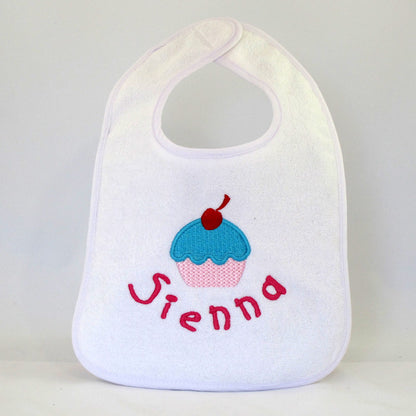 personalised girls baby bib embroidered with cupcake design and baby girls name