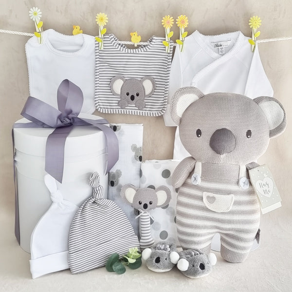 Organic baby neutral grey gift hamper with suit, bib, beanie, knitted soft koala toy, koala hand rattle, koala slippers, koala bib, koala muslin wrap, striped beanie and spotted muslin wrap.