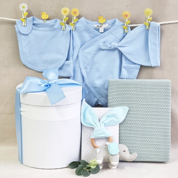 Organic baby boy blue gift hamper with knitted wood elephant teether, organic blanket, bib, beanie and suit.