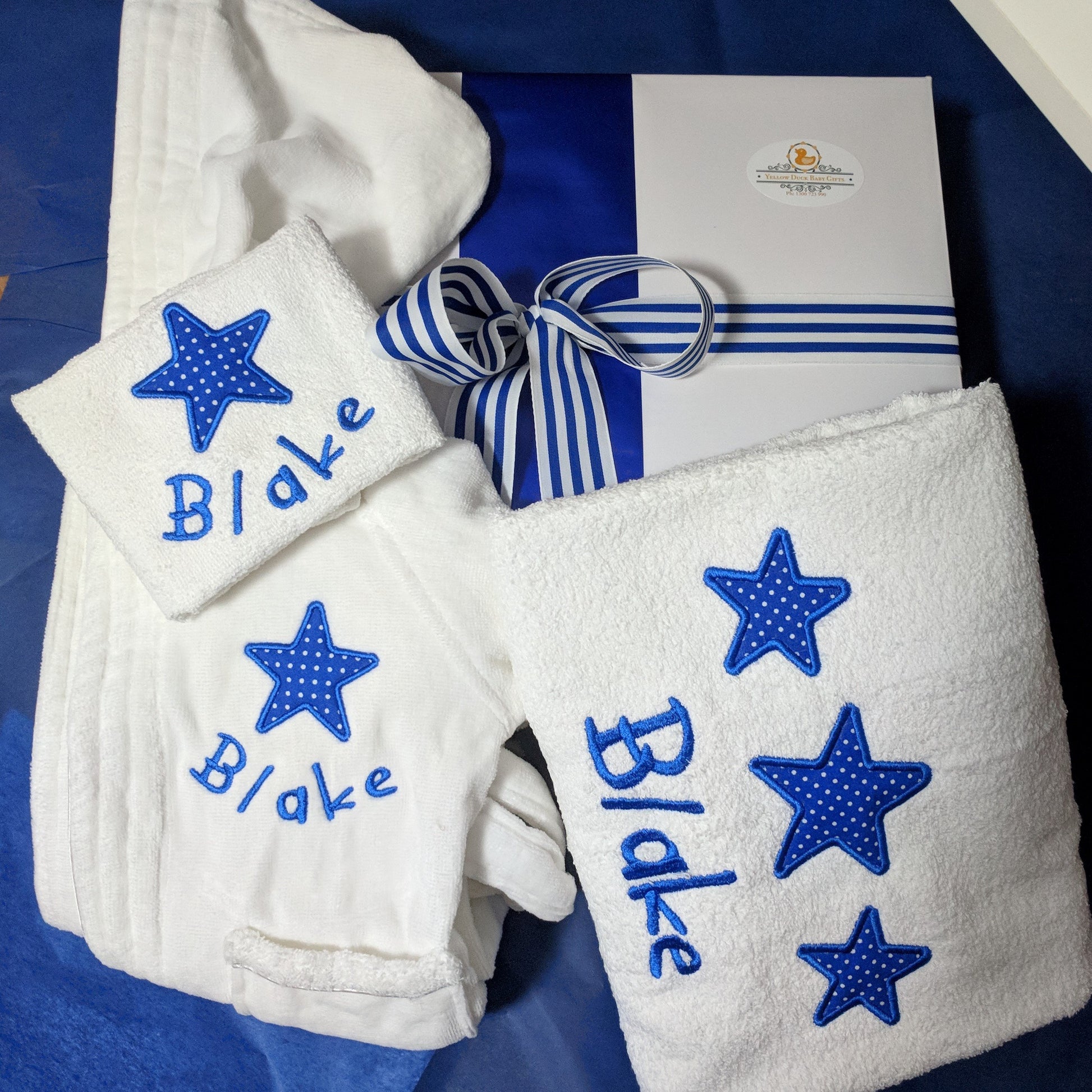 personalised baby bath robe and towel hamper embroidered with a star motif and personalised with the baby boys name arrives fully gift boxed