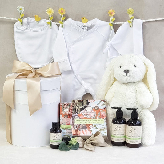 Organic baby hamper with neutral bib suit beanie and soft bunny with Kakadu Plum baby bath wash moisturiser and belly oil.