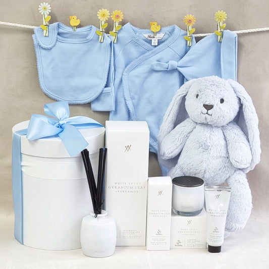 Organic mama and baby boys blue gift hamper with suit, beanie, bib, soy candle, room diffuser and hand cream.