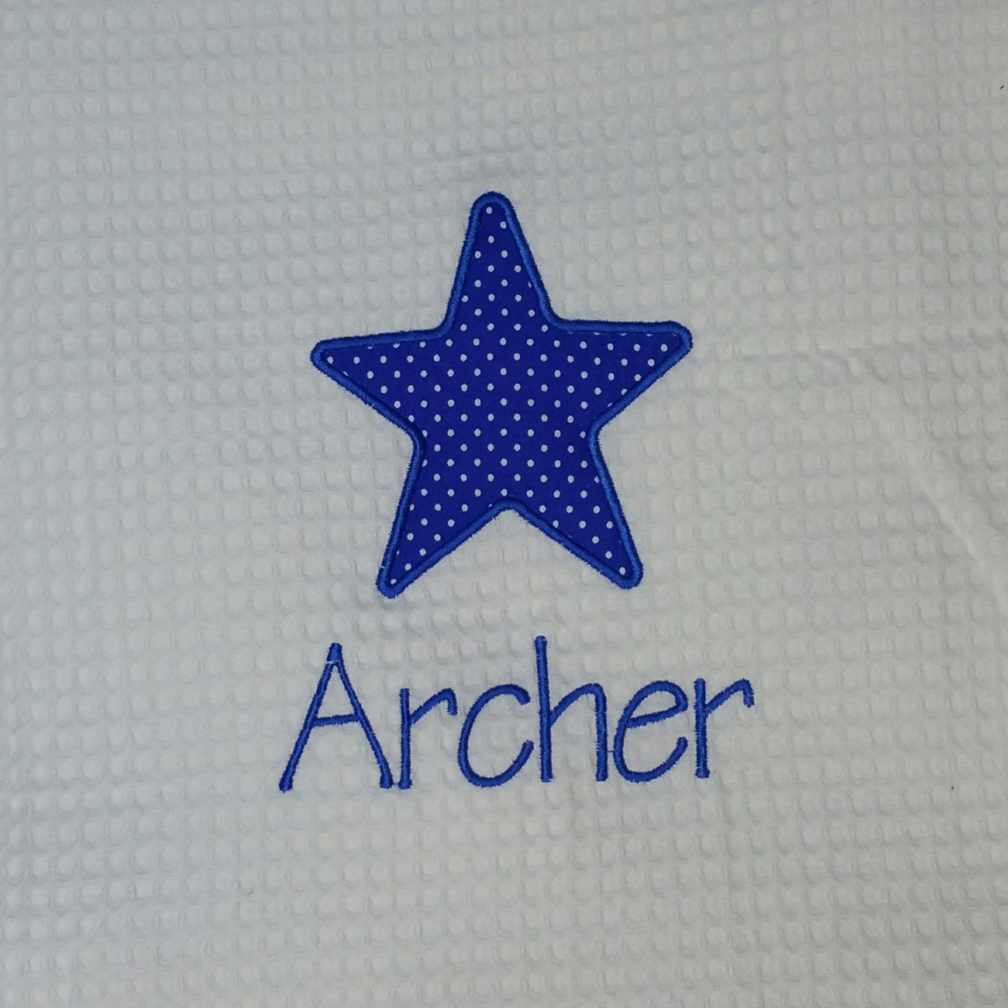 royal blue star applique` baby blanket close up view