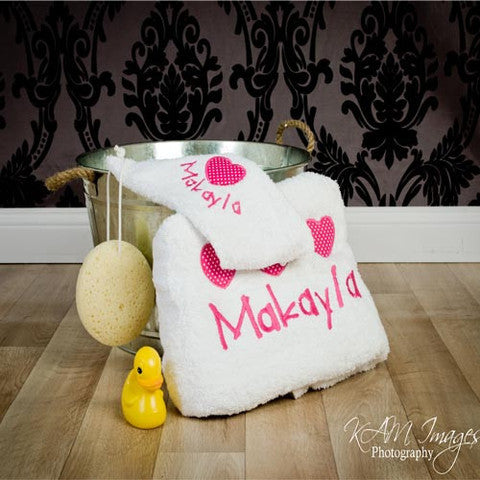 girls personalised bath towel & robe set hot pink embroidered with  hearts and personalised with baby's name