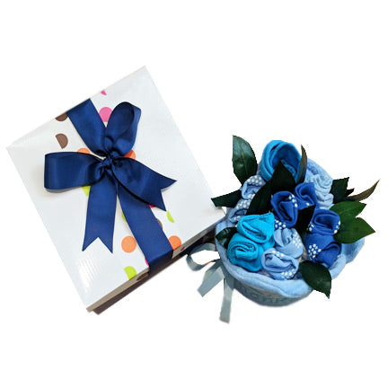 nappy cake for boys blue clothing rolled into a rose bouquet with hooded towel