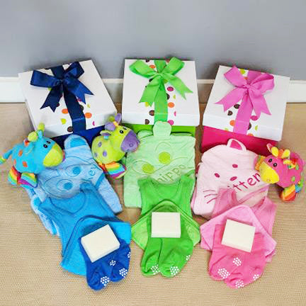 colourful baby gift hampers hooded towels and clothing