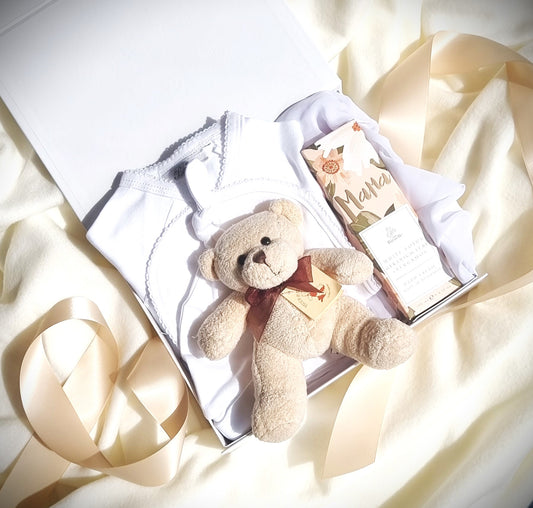 neutral baby and mama gift with little teddy bear white organic baby clothing with hand cream for mama