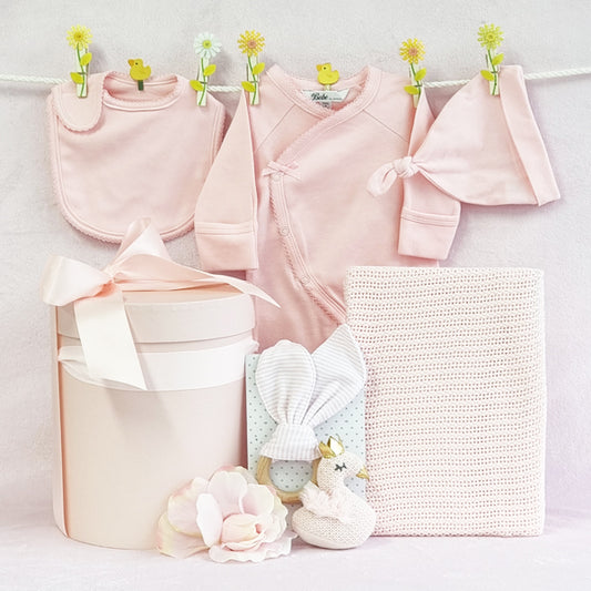 Organic baby girl pink gift hamper with knitted wood swan teether, blanket, bib, beanie and suit.