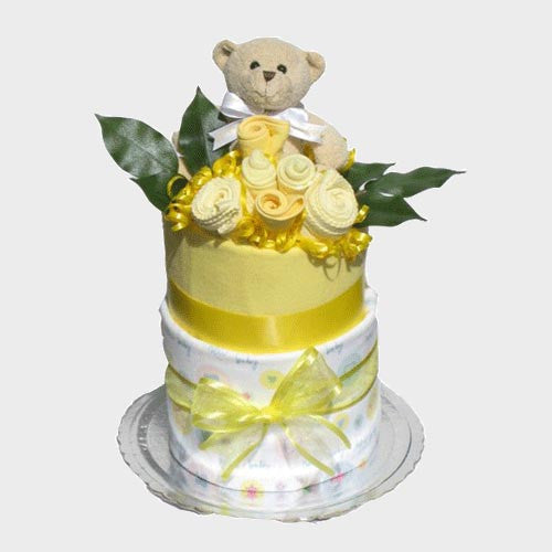 neutral colour 2 tier baby nappy cake with teddy and baby clothing